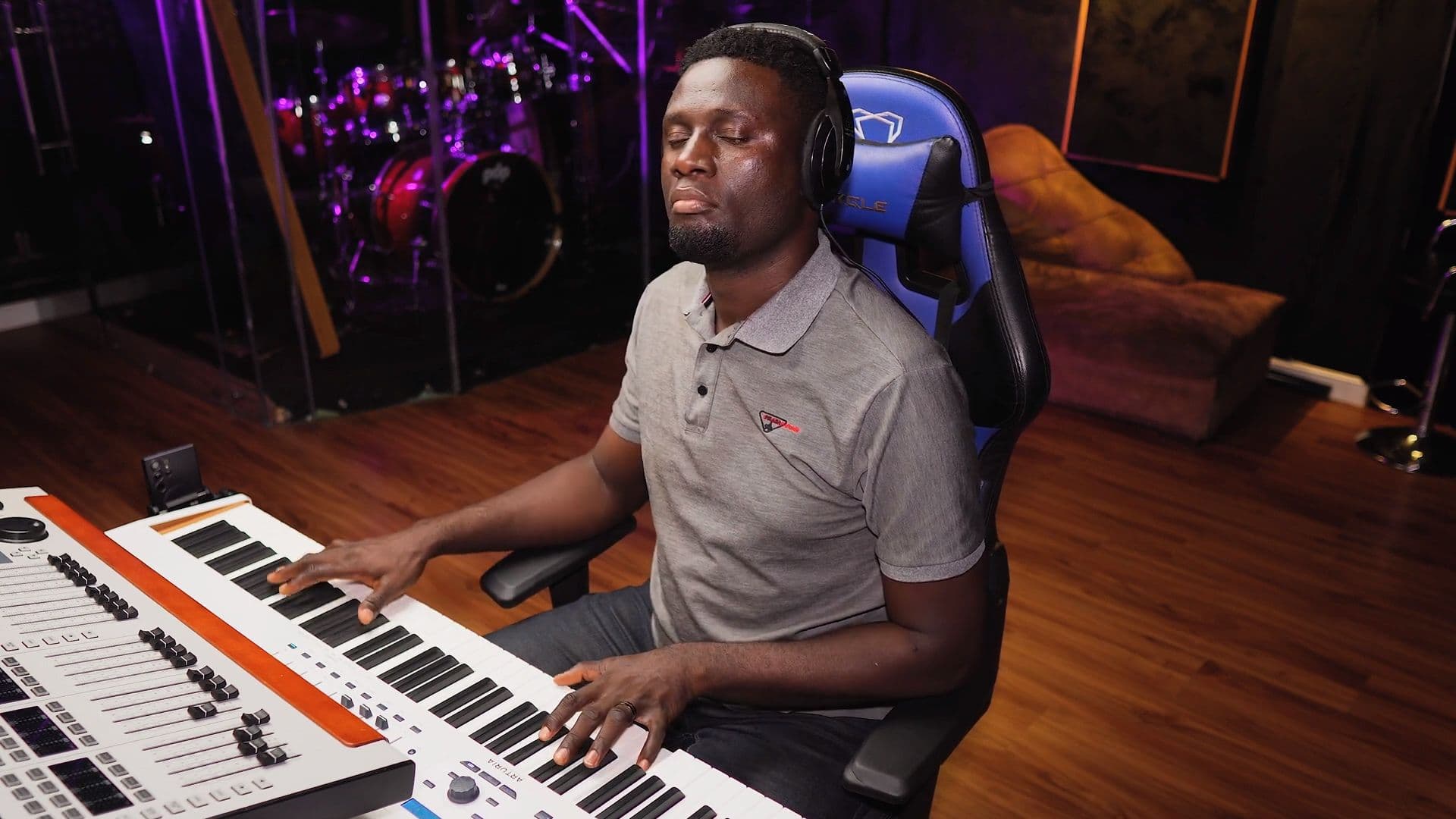 Godwin Owulo at the keys, in session